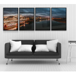 Mörkt stadsmotiv i panorama - Fyrdelad tavla